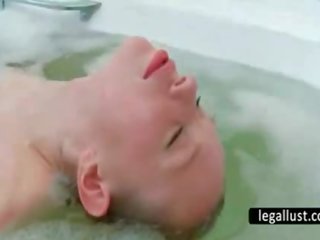 Slender chick washes quim in bathtub